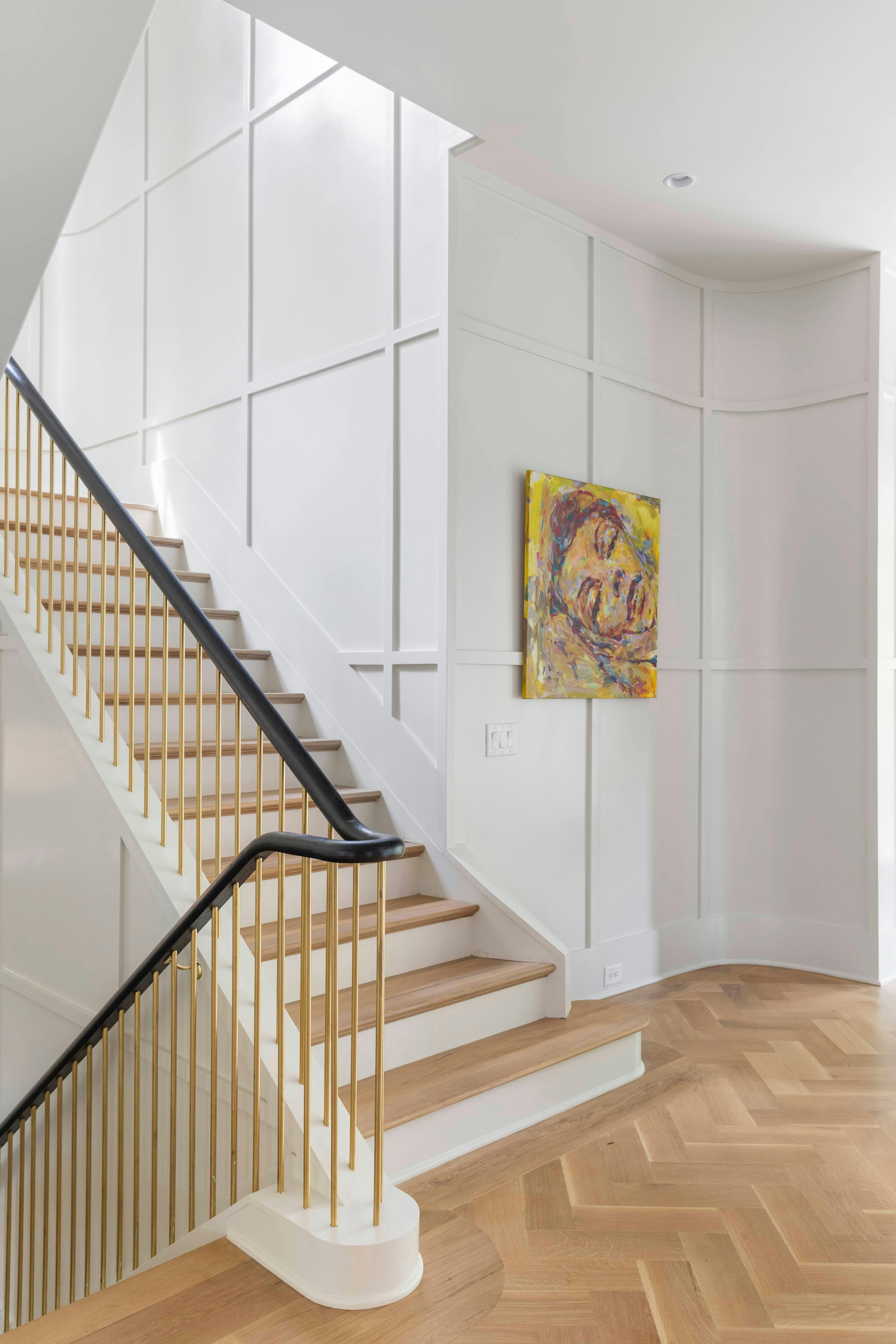Staircase with white painted balusters and risers