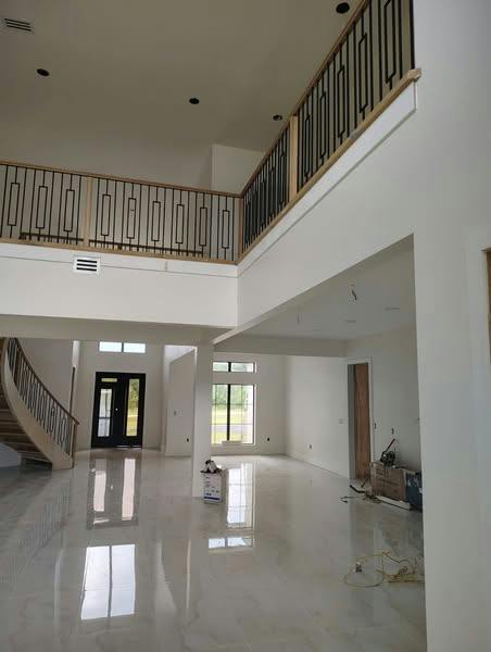 Finished staircase with wood treads, handrail and turned balusters