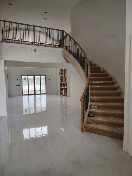 Finished staircase with wood treads, handrail and turned balusters