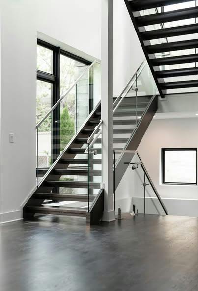 Open-riser staircase with floating wood treads