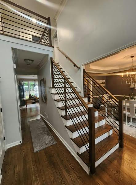 Staircase with white painted balusters and risers