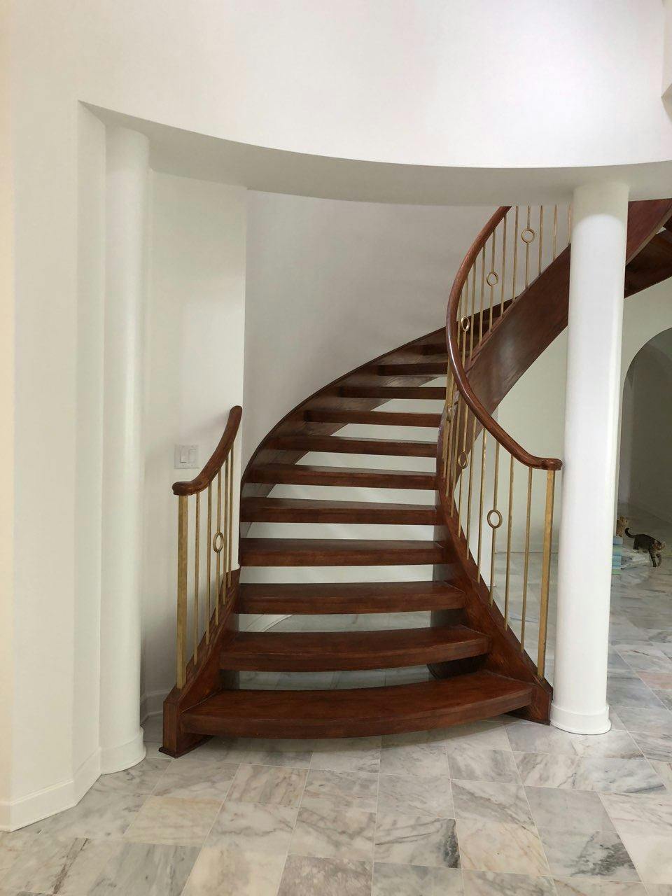Finished staircase with wood treads, handrail and turned balusters