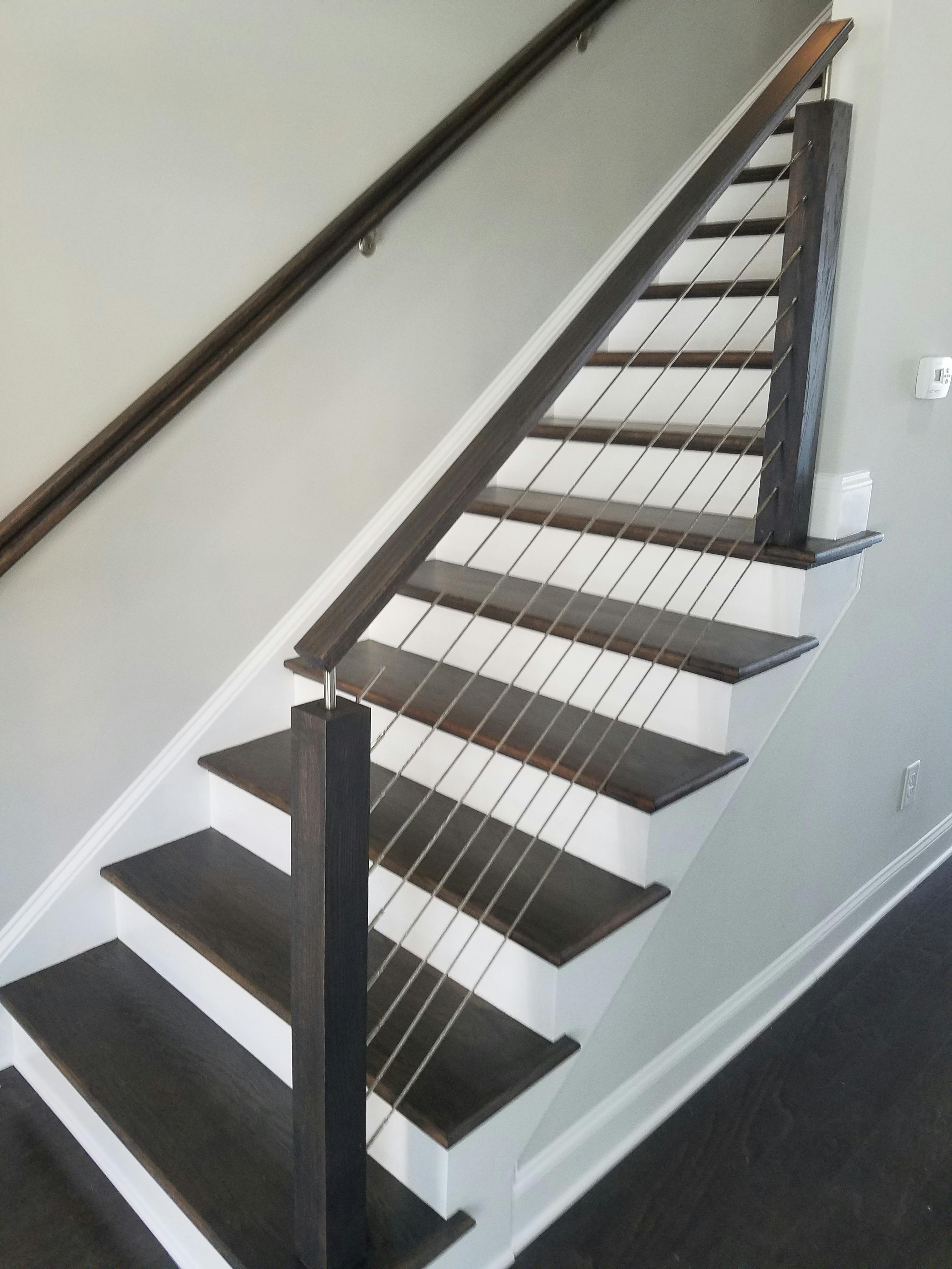 Staircase with white painted balusters and risers