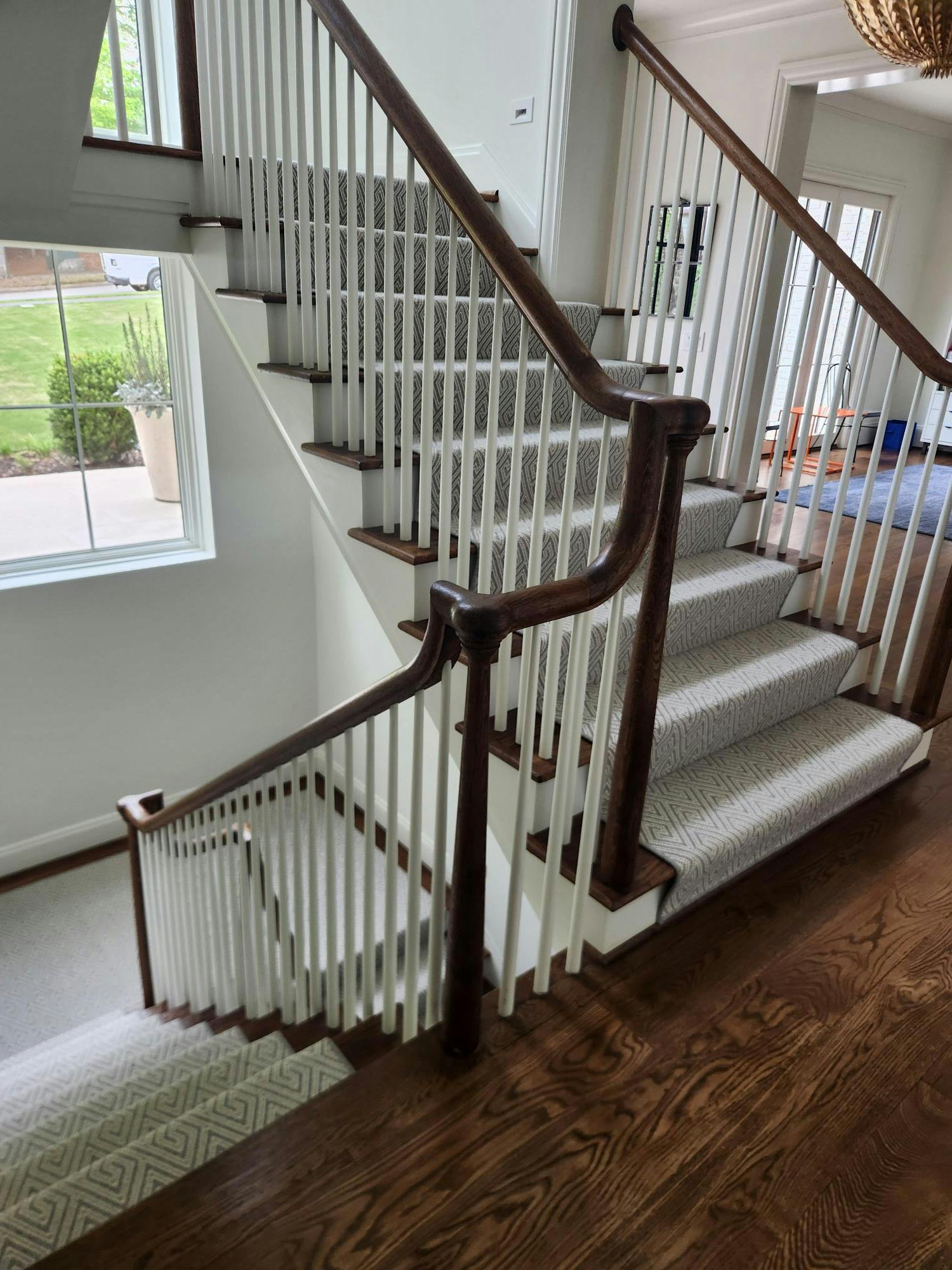 Staircase with white painted balusters and risers