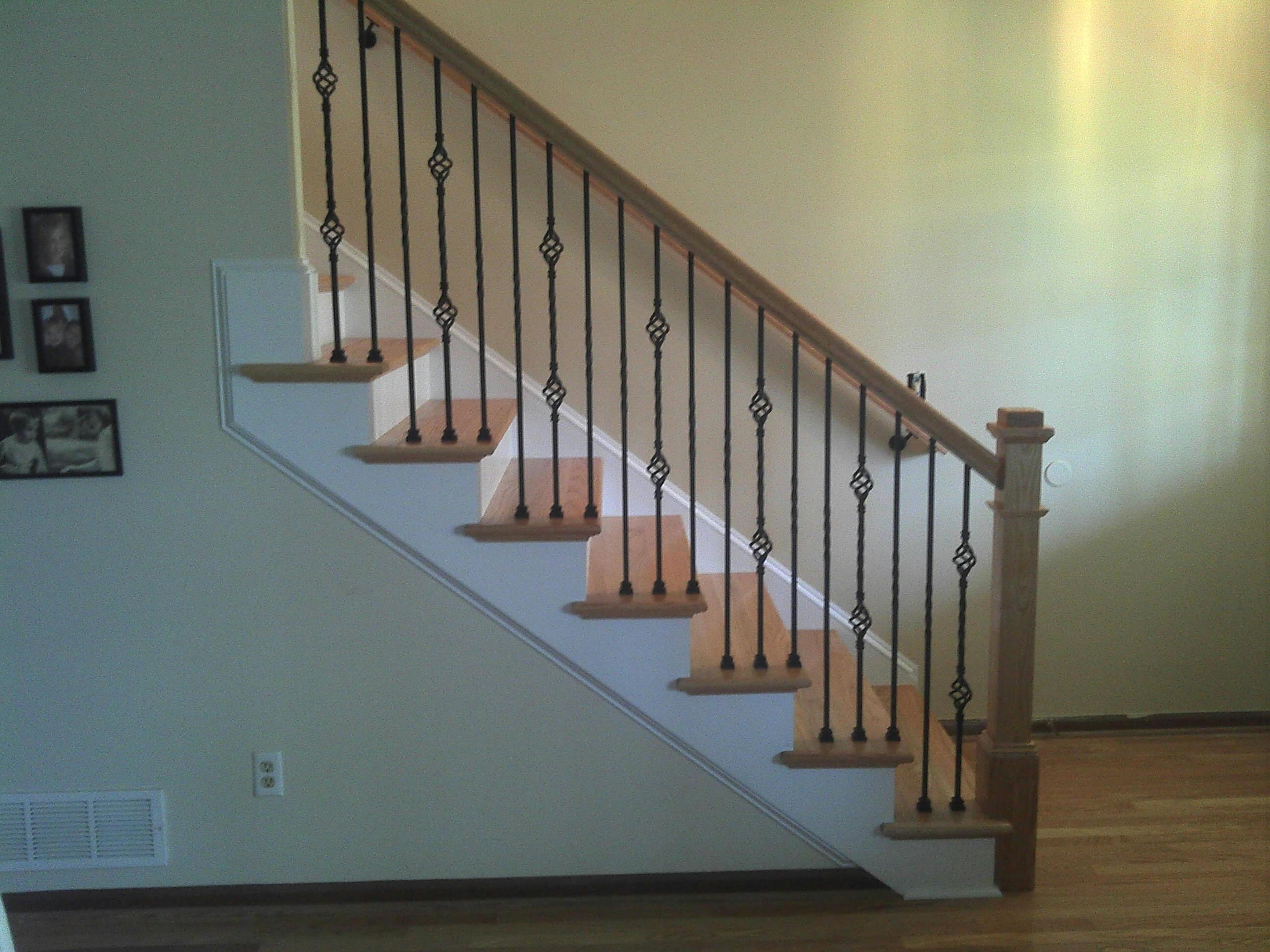 Staircase with white painted balusters and risers