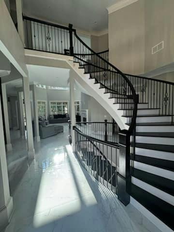 Staircase with white painted balusters and risers